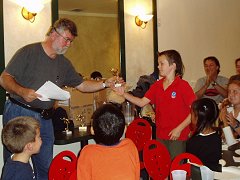 Henry receives his soccer trophy