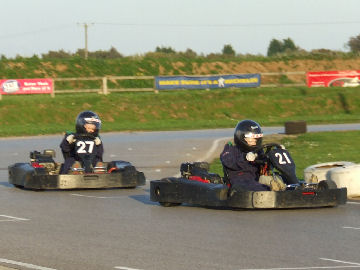 George (21) holds off Henry (27)