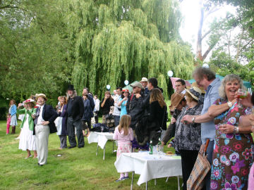 Spectators cheering on a passing crew