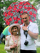 Misi shelters Edna under a floral one