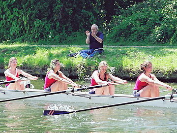 Spectator claps an Emma crew bedecked with foliage showing they got their bump